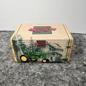 1/64 John Deere Model A Tractor With Man Ertl 50th Anniversary Commemorative